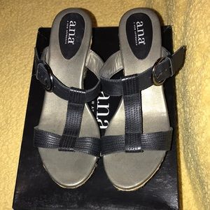 a.n.a woman’s wedged sandals, size 8 1/2, black & tan colored heel.